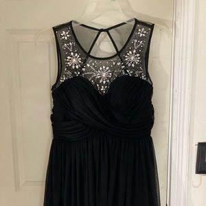 it is a short prom dress that goes a little bit above the knees